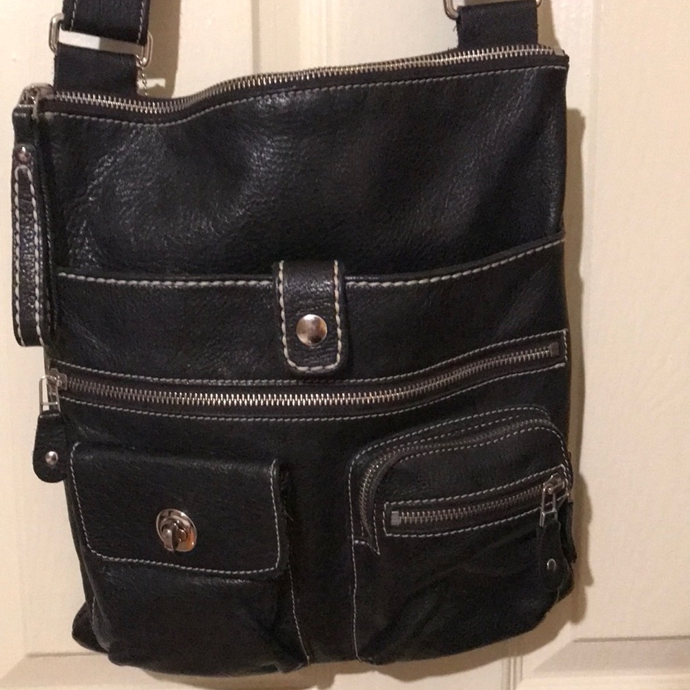 Roots black leather crossbody bag. Good condition Strap is also leather